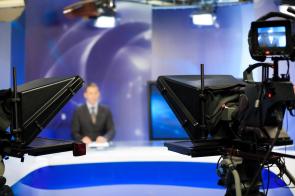 Video camera lens - recording show in TV studio - focus on camera